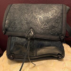 Navy embossed leather backpack. Distressed look.